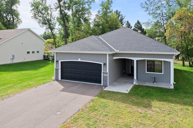 ranch-style house with a garage and a front lawn