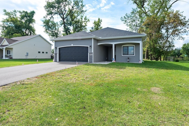 ranch-style home with a front yard and a garage