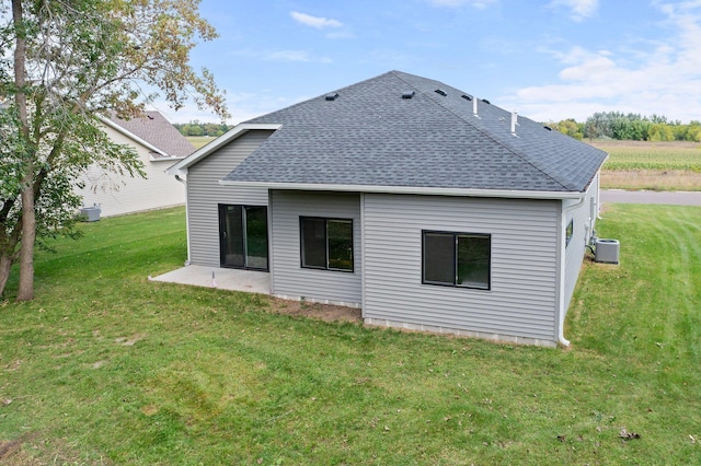 back of property with a yard and cooling unit