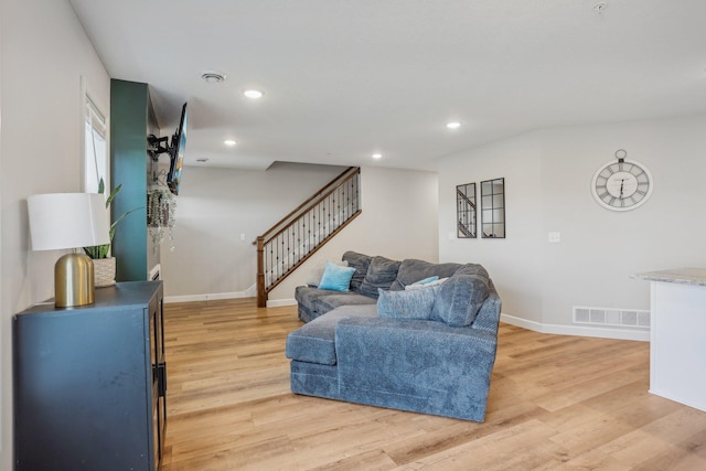 living room with light hardwood / wood-style floors