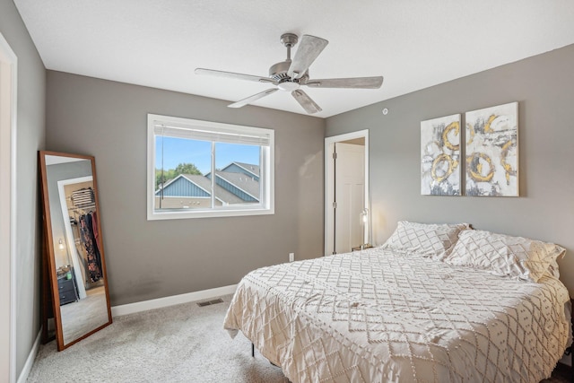 bedroom with ceiling fan and carpet flooring