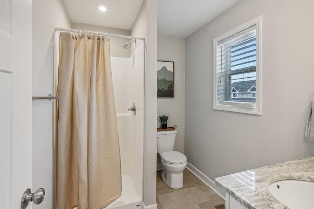 bathroom with vanity, toilet, and a shower with curtain