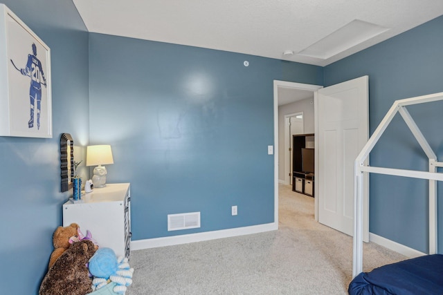 bedroom featuring light carpet