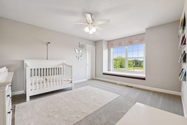 bedroom featuring light carpet, visible vents, and baseboards