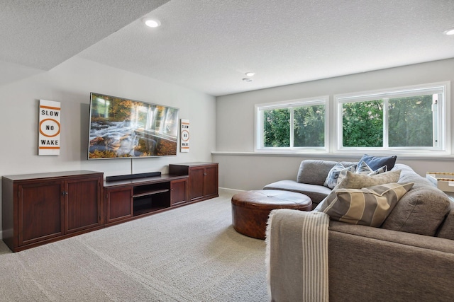 carpeted living room featuring recessed lighting, a textured ceiling, and baseboards