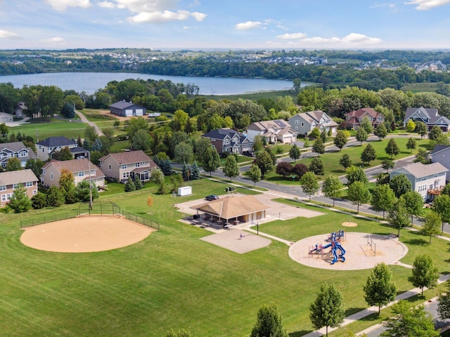 drone / aerial view featuring a water view and a residential view