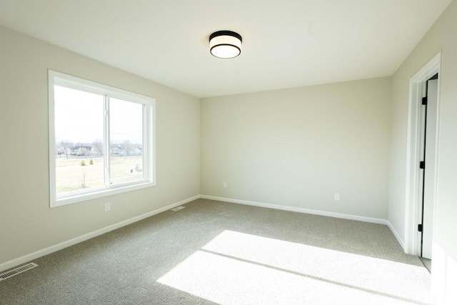 spare room featuring carpet flooring