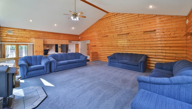 carpeted living area featuring recessed lighting, log walls, and high vaulted ceiling