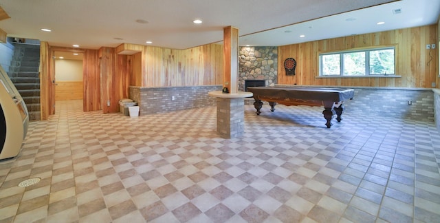 interior space with visible vents, pool table, a fireplace, and stairs