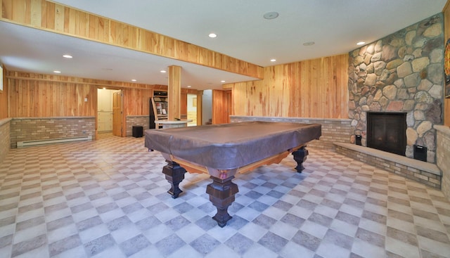 game room with recessed lighting, wooden walls, and a fireplace