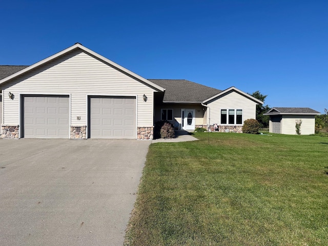 ranch-style house featuring a garage and a front yard