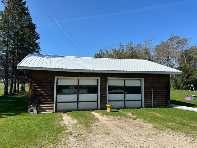 garage with a yard