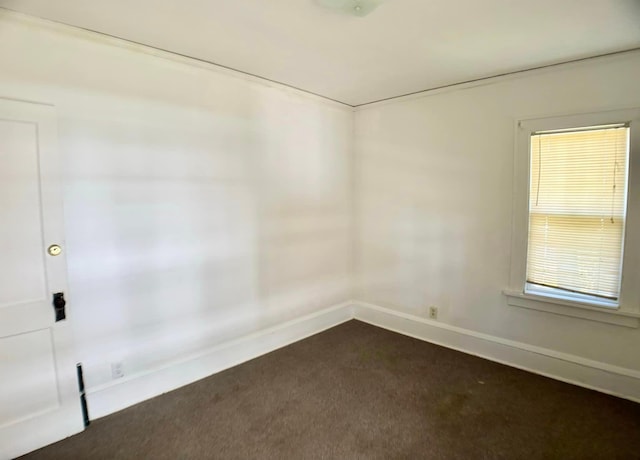 empty room with dark carpet