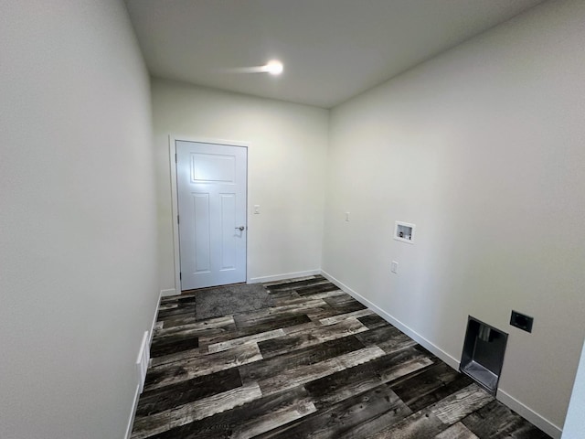 laundry room with dark wood-style flooring, baseboards, laundry area, and washer hookup