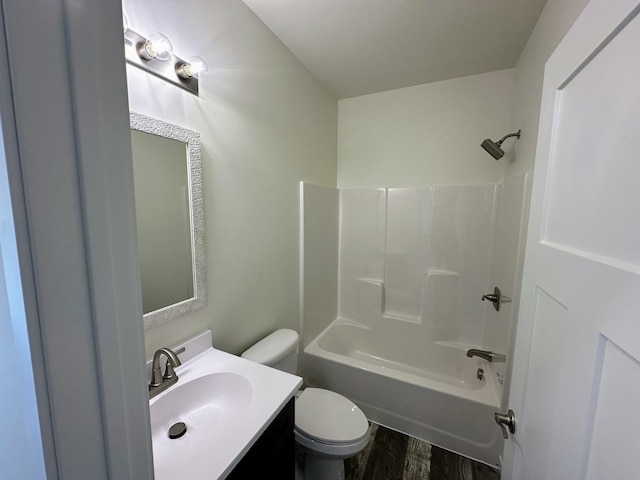 full bathroom featuring wood-type flooring, vanity, shower / bath combination, and toilet