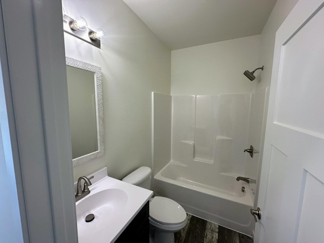 bathroom featuring shower / bath combination, vanity, toilet, and wood finished floors