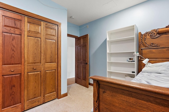 carpeted bedroom featuring a closet