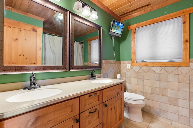 bathroom with wooden ceiling, tile walls, toilet, vanity, and tile patterned flooring