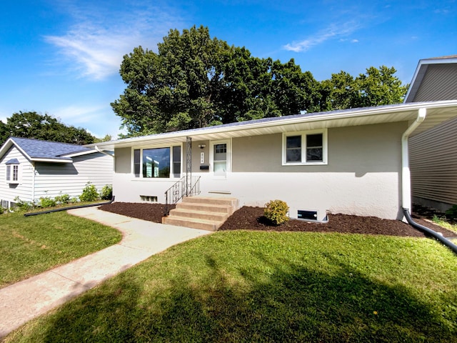 ranch-style house featuring a front yard