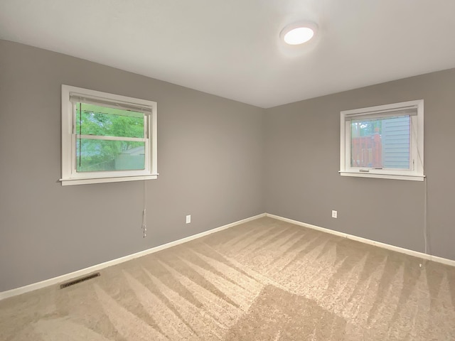 spare room featuring carpet flooring