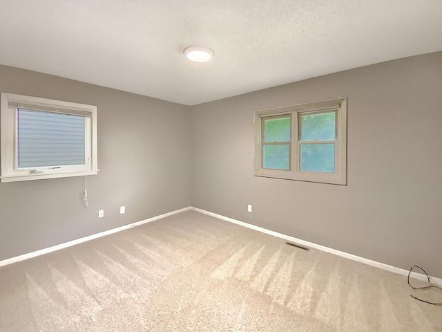 spare room with carpet flooring