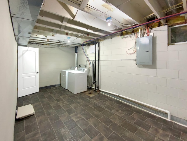 basement featuring electric panel and independent washer and dryer