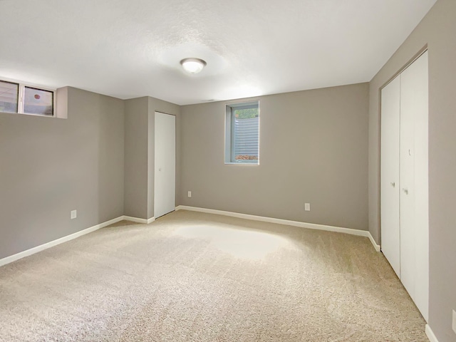 unfurnished bedroom with light colored carpet