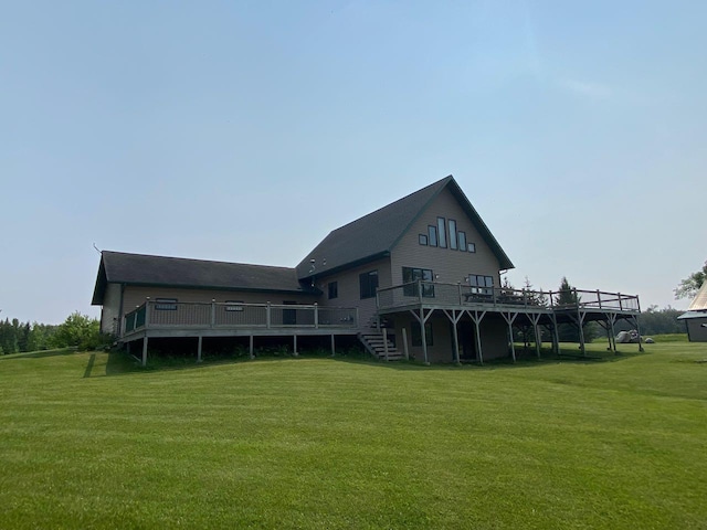 back of house with a deck and a lawn