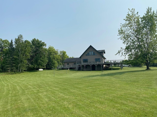 view of yard featuring a wooden deck