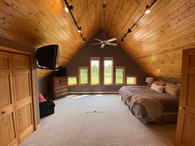 carpeted bedroom featuring a baseboard heating unit, vaulted ceiling, track lighting, and wood ceiling