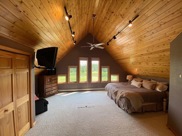 carpeted bedroom featuring baseboard heating, vaulted ceiling, track lighting, and wood ceiling