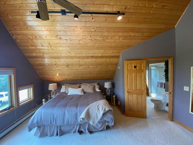 unfurnished bedroom with wooden ceiling, baseboard heating, vaulted ceiling, and ensuite bathroom