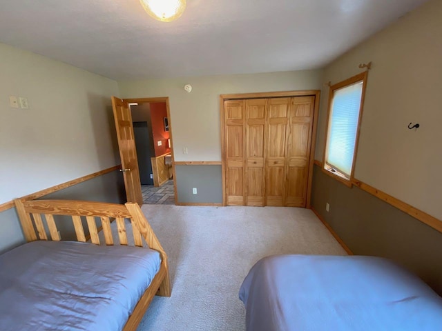 carpeted bedroom featuring a closet