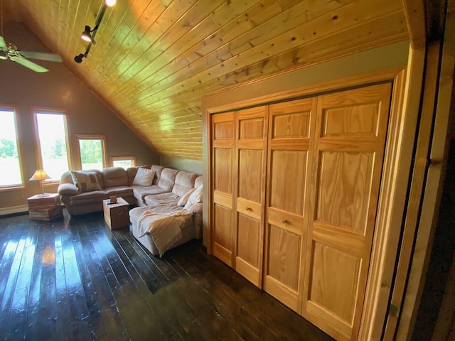 living room with lofted ceiling, dark wood-type flooring, rail lighting, ceiling fan, and wooden ceiling