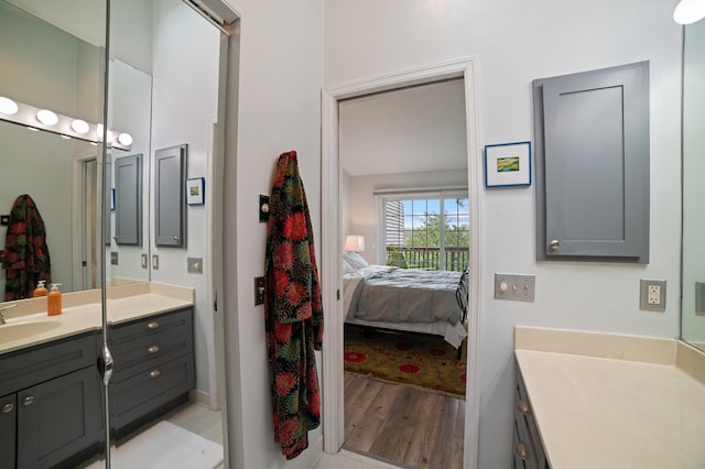 17661 Southridge Ct, Minnetonka, MN 55345 - ensuite bathroom featuring vanity and wood finished floors