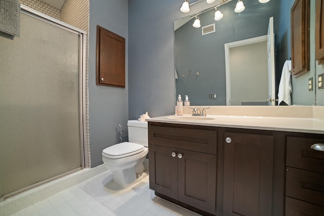 17661 Southridge Ct, Minnetonka, MN 55345 - full bathroom featuring toilet, a shower stall, vanity, and tile patterned flooring