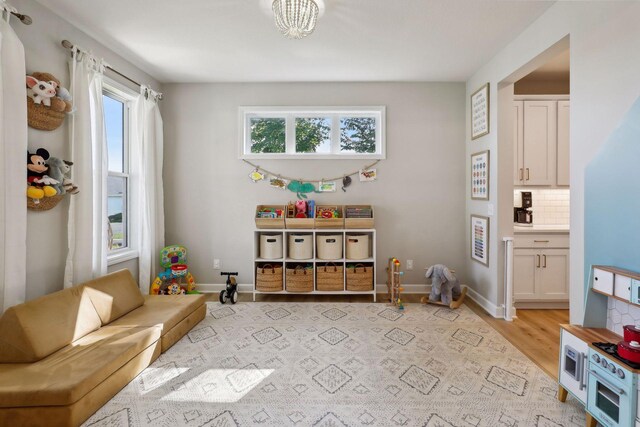 playroom with light hardwood / wood-style floors