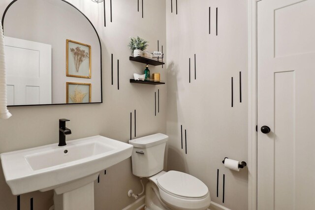 bathroom with sink and toilet