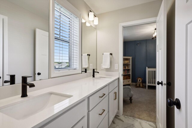 bathroom featuring a wealth of natural light and vanity