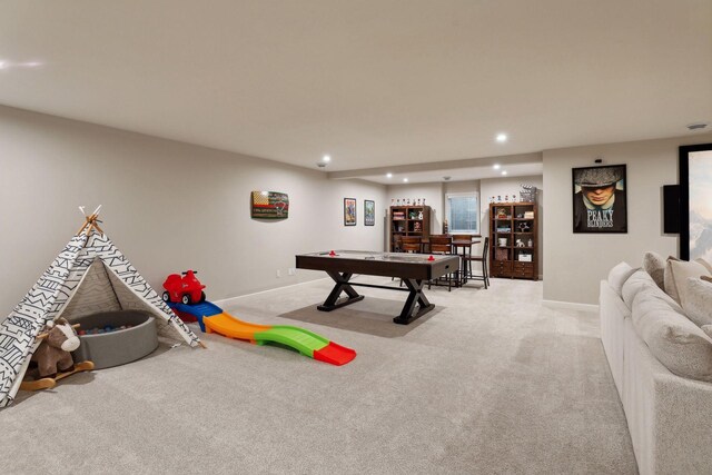 recreation room with light carpet