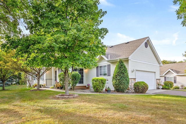 view of property hidden behind natural elements featuring driveway, a garage, stone siding, roof with shingles, and a front yard