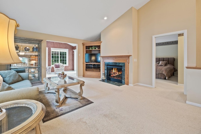 living area with a fireplace, recessed lighting, carpet flooring, high vaulted ceiling, and baseboards