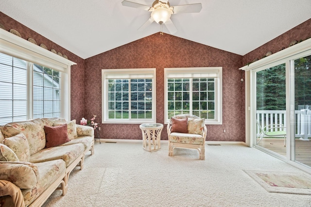 sunroom featuring a ceiling fan and lofted ceiling