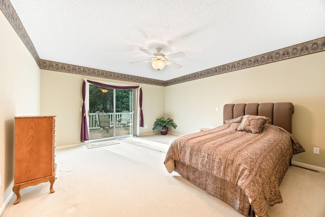 bedroom featuring carpet floors, access to outside, a textured ceiling, and baseboards