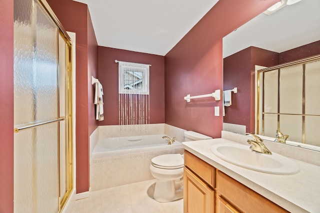 full bath featuring a garden tub, toilet, vanity, a shower stall, and tile patterned floors