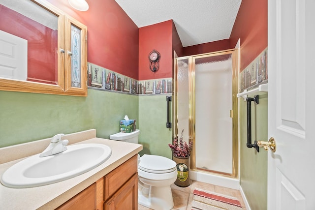 bathroom featuring toilet, a stall shower, a textured ceiling, vanity, and tile patterned floors