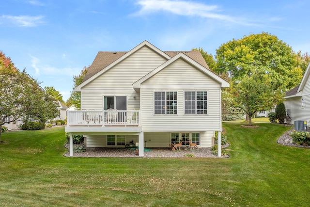 back of house with central air condition unit, a wooden deck, a lawn, and roof with shingles