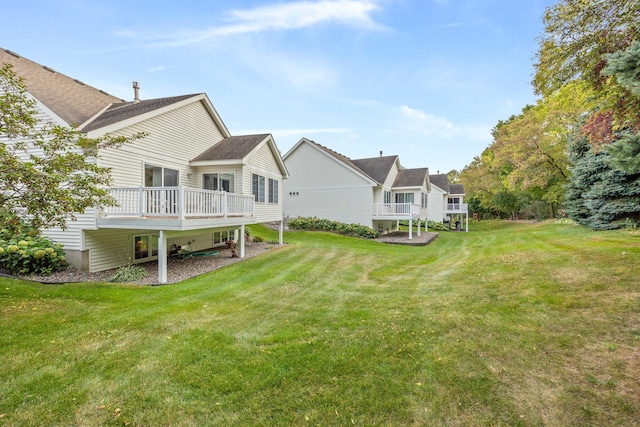 rear view of property featuring a yard