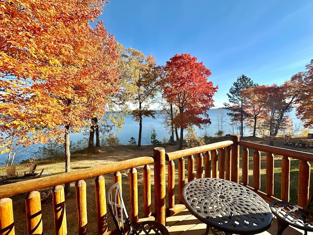 wooden terrace featuring a water view