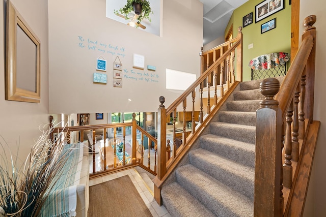 stairway with tile patterned flooring